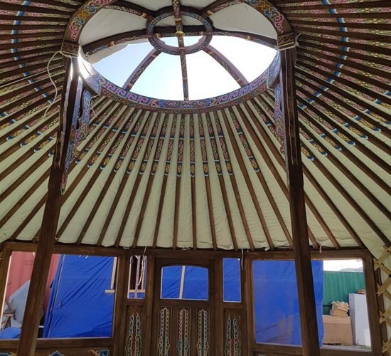 Brown yurt inside crown