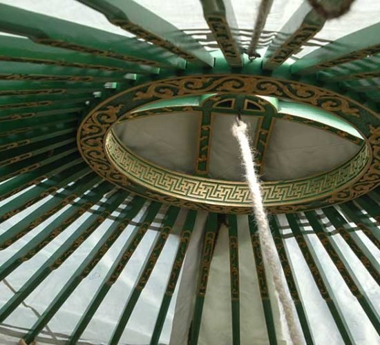Green yurt inside crown
